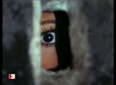 Ana Belen eavesdrops on a disturbing conversation about her and her husband in Morbo (1972).