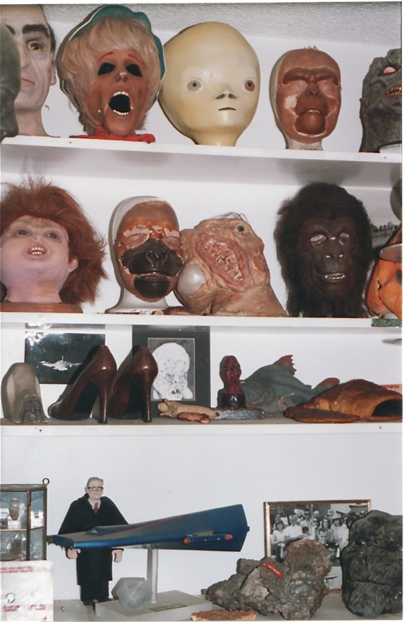 One of many shelves filled with collectibles at The Ackermansion (1998) photo by J. Stafford