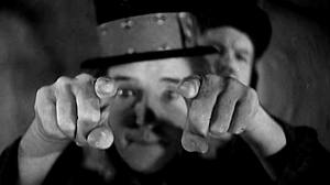 Stan Laurel with Oliver Hardy (background) in The Bohemian Girl (1936)