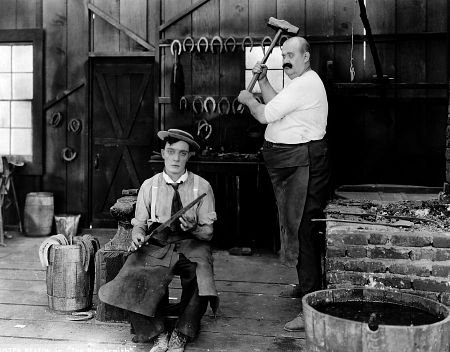 Buster Keaton and Joe Roberts in the 1922 two-reeler comedy, The Blacksmith 
