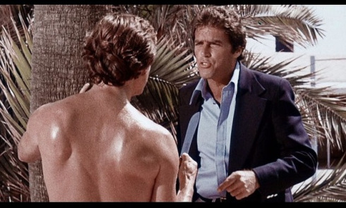 David Bailey (right) questions a suspect in Wicked, Wicked (1973)