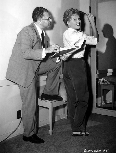 A publicity still of director George Cukor on the set of The Marrying Kind with Judy Holliday