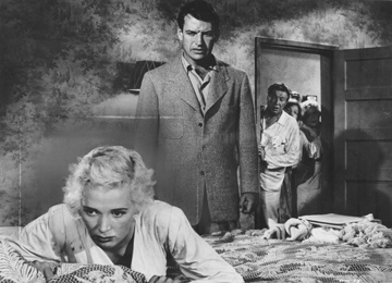 Richard Egan berates Beverly Michaels in a scene from Wicked Woman.
