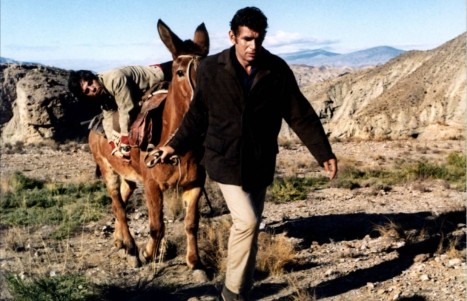 Michel Constantin (foreground) and Julian Mateos on the donkey in Les Etrangers (1969)