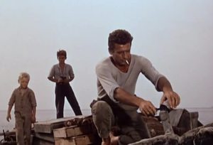 Yves Montand (foreground) in The Wide Blue Road (1957)