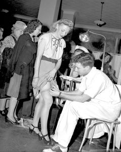 Smallpox vaccine is administered to citizens of New York City in 1947 during an outbreak of the disease