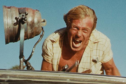 Jack Thompson is exhilarated by the thrill of the hunt in Wake in Fright (1971)