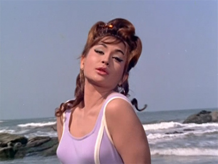Helen does an exotic beach sequence musical number in Gumnann (1965)