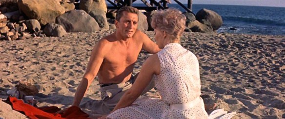 Kirk Douglas & Kim Novak cheat on their spouses in the 1960 soap opera, Strangers When We Meet. 