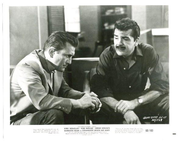 Architect Kirk Douglas shares his personal troubles with successful author Ernie Kovacs in Strangers When We Meet (1960). 