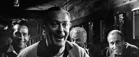 Curd Jurgens (center) celebrates a personal victory in I Aim at the Stars (1960)