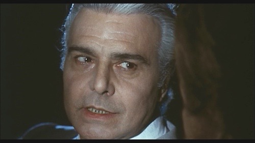 Gianni Santuccio plays the ominous stranger David (Ray Lovelock) meets on the road at night in Queens of Evil (1970).