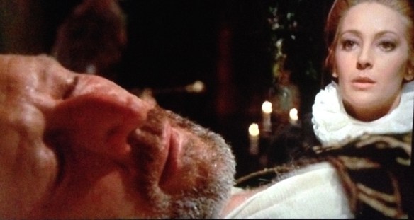 Lucretia Cenci (played by the actress Mavie) eyes her drugged husband Francesco (George Wilson) just prior to his murder.