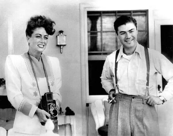 Joan Crawford poses with a camera with famous photographer Phil Stern